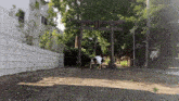 a person is doing a handstand in front of a wooden archway