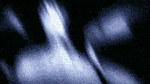 a blurry image of a person 's face with a dark background