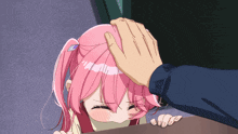 a girl with pink hair is being touched by a hand