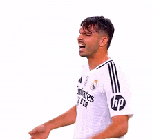 a man wearing a white emirates fly better shirt