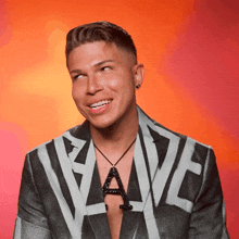 a man wearing a jacket with the word wave written on it