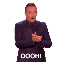 a man in a suit and bow tie is saying it 's a good show in it