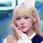 a close up of a girl with blonde hair