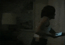 a blurry picture of a person standing in the dark