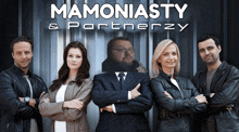 a group of people standing in front of a sign that says mamoniasty and partnerzy