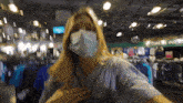 a woman wearing a face mask in a store with a sign that says take me out