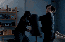 a man in a suit is dancing with a woman in a mask