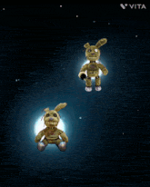 two stuffed rabbits are floating in the air with the vita logo in the upper right corner