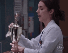 Greys Anatomy Jules Millin GIF - Greys Anatomy Jules Millin Cleaning Trophy GIFs
