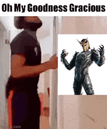 a man with a beard is standing next to a picture of a man with horns on his head .