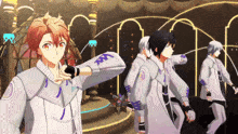 a group of anime characters are dancing on a stage and one of them is wearing a shirt that says ' nm '