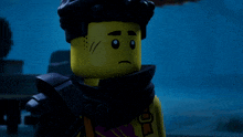 a close up of a lego figure with a surprised look on his face