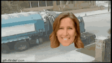 a woman is smiling in front of a garbage truck with gif-finder.com at the bottom of the screen