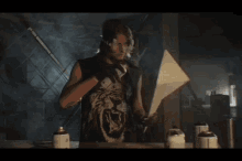 a man in a tiger shirt is holding a sword