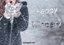 a picture of a woman blowing snow and the words happy winter