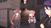three anime girls standing in front of a building