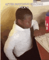 a young boy is sitting at a desk with his eyes closed and the words after watching falcons pick written above him .