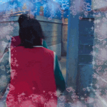a person in a red vest is surrounded by hearts