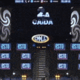 a stage with a large screen that says la cada