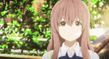 a girl with long pink hair and brown eyes is standing in front of trees .