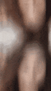 a blurred image of a person 's torso with a white background