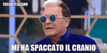 a man wearing sunglasses and a blue shirt says trash italiano mi ha spaccato il cranio
