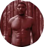 a shirtless man with a tattoo on his arm