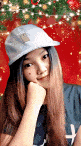 a girl wearing a hat and a shirt with the letter h on the front
