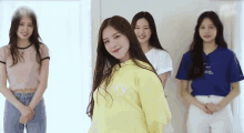 a girl wearing a yellow sweatshirt with the word kitty on it