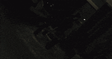 a dark room with a few lights on the walls
