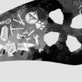 a black and white drawing of various objects including a compass and a hammer