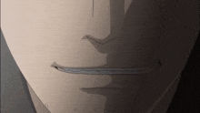 a close up of a man 's face with a slight smile