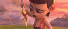 a cartoon character is holding a sword in a field and looking at the camera .