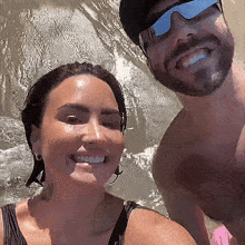 a man and a woman are smiling for a picture