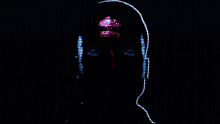 a silhouette of a person 's face with glowing eyes and headphones on