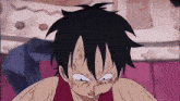 monkey d luffy from one piece is making a funny face with his hands on his head .