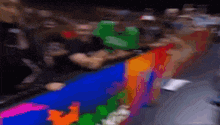 a blurry picture of a crowd of people sitting in a stadium