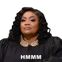a woman in a black gown with the word hmm on her face