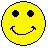 a pixel art smiley face with black eyes and a smile on it .