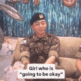 a man in a military uniform sits on a couch with a sign that says " girl who is "