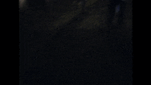 a man in a blue shirt is carrying another man