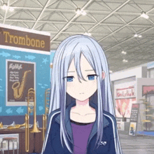 a girl stands in front of a trombone sign