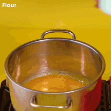a pot of flour is on a stove top