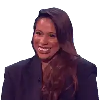 a woman with long brown hair is smiling and wearing a black blazer
