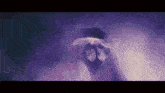 a close up of a person 's face in a dark room