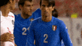 a soccer player with the number 2 on his shirt