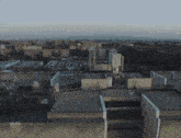 an aerial view of a city with a building that says ' a ' on the top