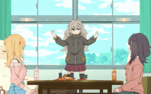 a girl stands in front of a table with snacks and a bottle of orange juice