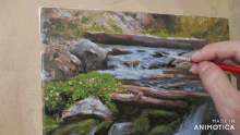 a person is painting a waterfall with the words made in animotica below it