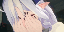 a cartoon character with white hair and black nails covering her face